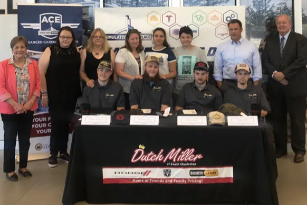 Group of students sit at a table