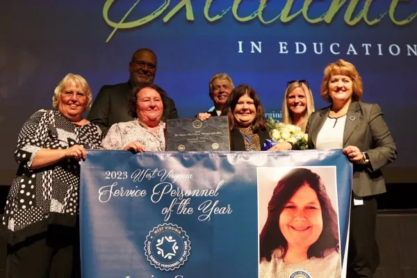 Group photo with 2023 Service Personnel of the Year Jessica Grose.