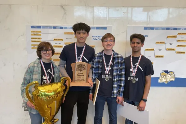 Morgantown team holding 1st place award at Academic Showdown.