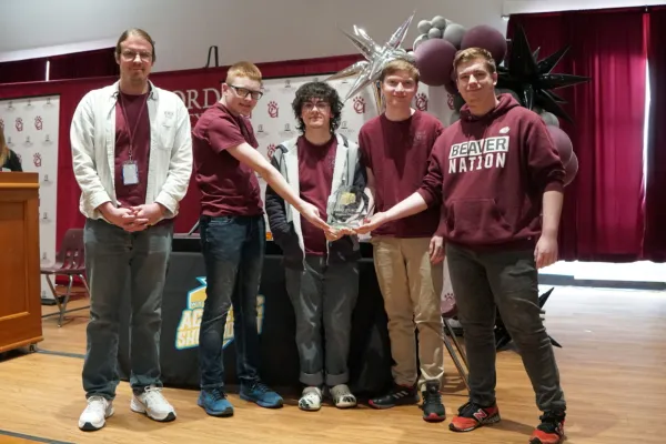 Bluefield High School students posing with a first-place trophy.