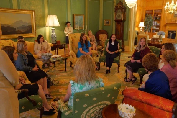 Photo of 2024 Ball Toyota Scholar event attendees conversing in a grand space at the Governor's Mansion.