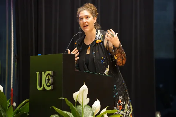 Woman speaking from a podium.