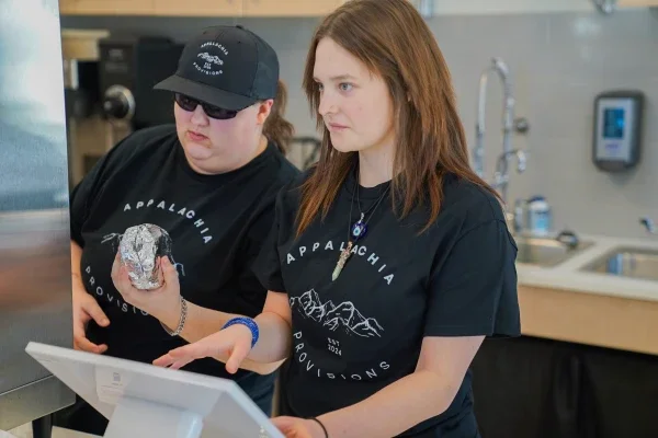 Two students working in a café.