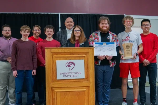 Members of Bridgeport High School's Academic Showdown team holding a trophy.