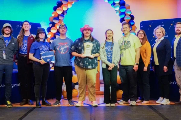 Members of Morgantown High School's Academic Showdown team holding a trophy.