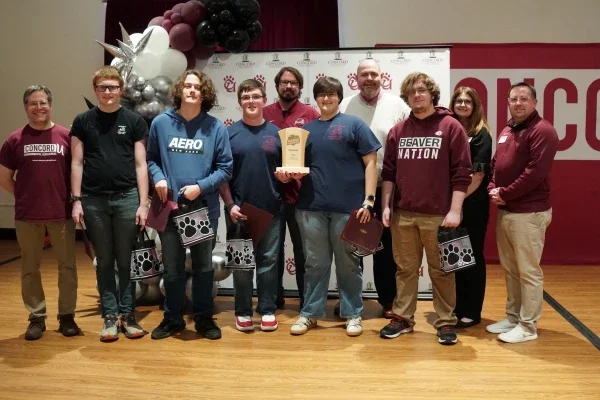 Members of Bluefield High School's Academic Showdown team holding a trophy.