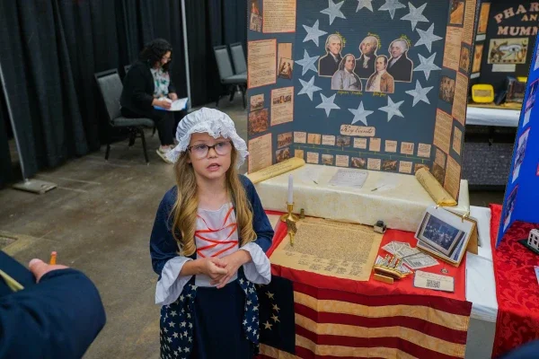 A student presenting her project. 