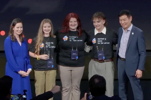 Student representatives from Huff Consolidated Elementary and Middle School smiling while holding an award.