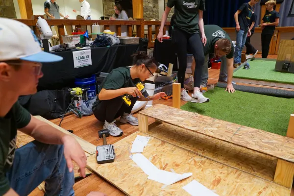 A student working with wood. 