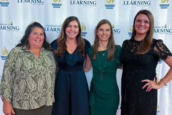 Lisa Cook, Miriam Mason, Alicia Riggleman, and Laura Presley smiling. 