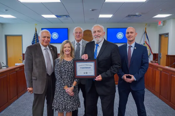 Scott Rotruck and other West Virginia Board of Education members smiling. 