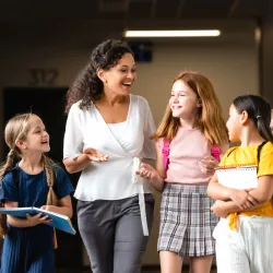 Ready Read Write Banner - Administrator with students.