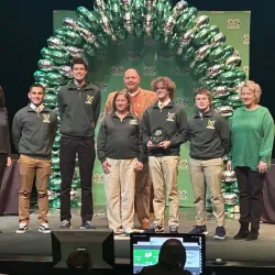 Huntington high school team holding first place trophy