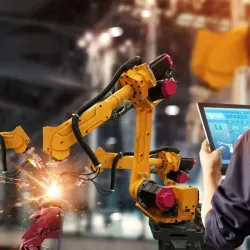 Robotic arm works in a factory