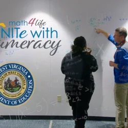 A man and a woman point at a whiteboard with the WVDE Unite With Numeracy Logo next to them.
