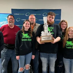 Students at the November 14, 2023 MCTEC event showing off their trophy.