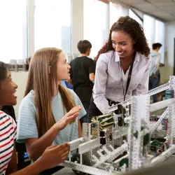Teacher and two students in science classroom
