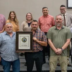 Huttonsville Correctional Facility staff accept the 2024 WVSDT Program of the Year award.