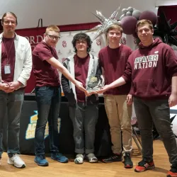 Bluefield High School students posing with a first-place trophy.