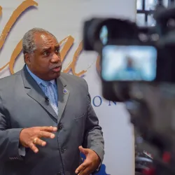 Person being interviewed on camera.