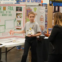 Student presenting his project to judges.