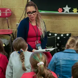 A teacher reading to students.