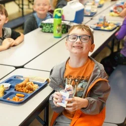 Students eating lunch in a school cafeteria.