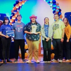 Members of Morgantown High School's Academic Showdown team holding a trophy.