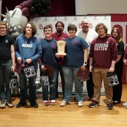 Members of Bluefield High School's Academic Showdown team holding a trophy.