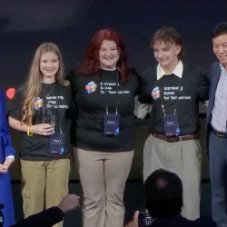 Student representatives from Huff Consolidated Elementary and Middle School smiling while holding an award.