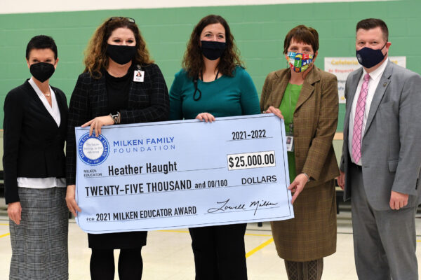 Heather Haught presented Milken Award Check, also pictured Jane Duffy, Shelby Hanes, and Clayton Burch