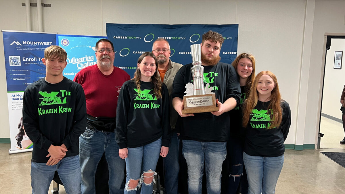 Students at the November 14, 2023 MCTEC event showing off their trophy.