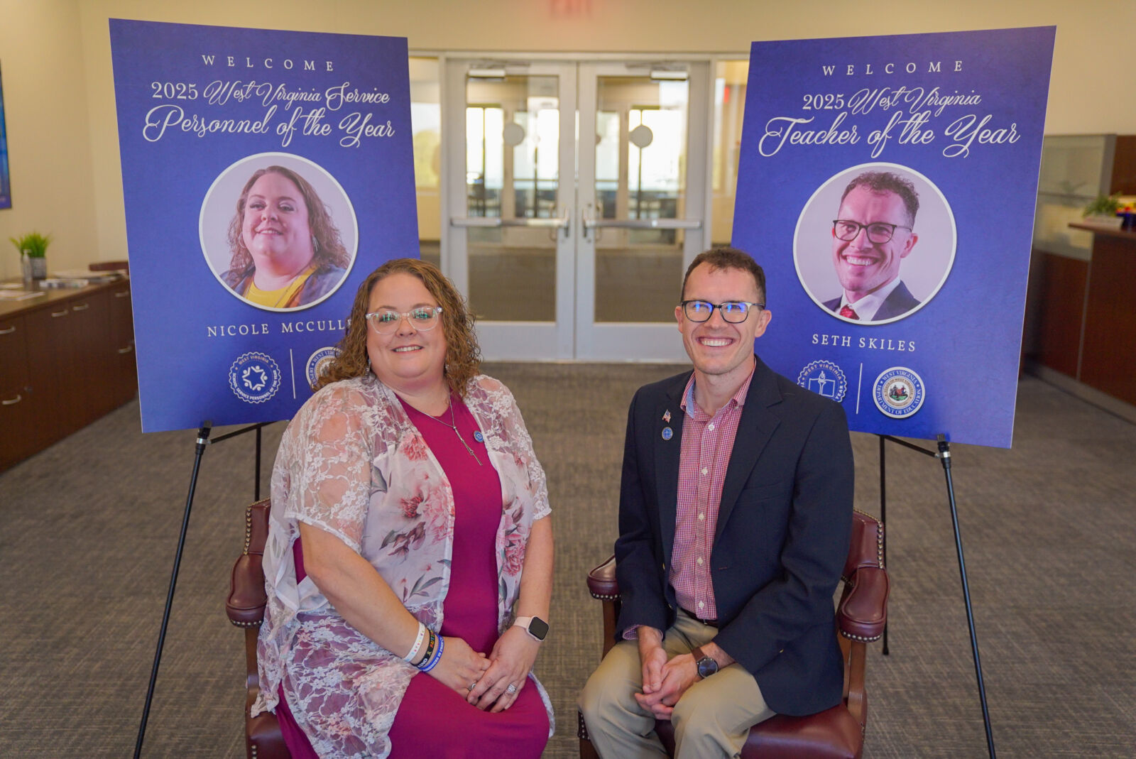 Seth Skiles and Nicole McCulley sitting in chairs smiling.